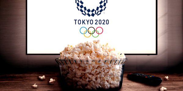 Tokyo Olympics logo on TV screen in front of popcorn